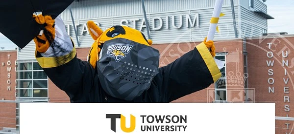 Doc the tiger in a graduation robe and mask