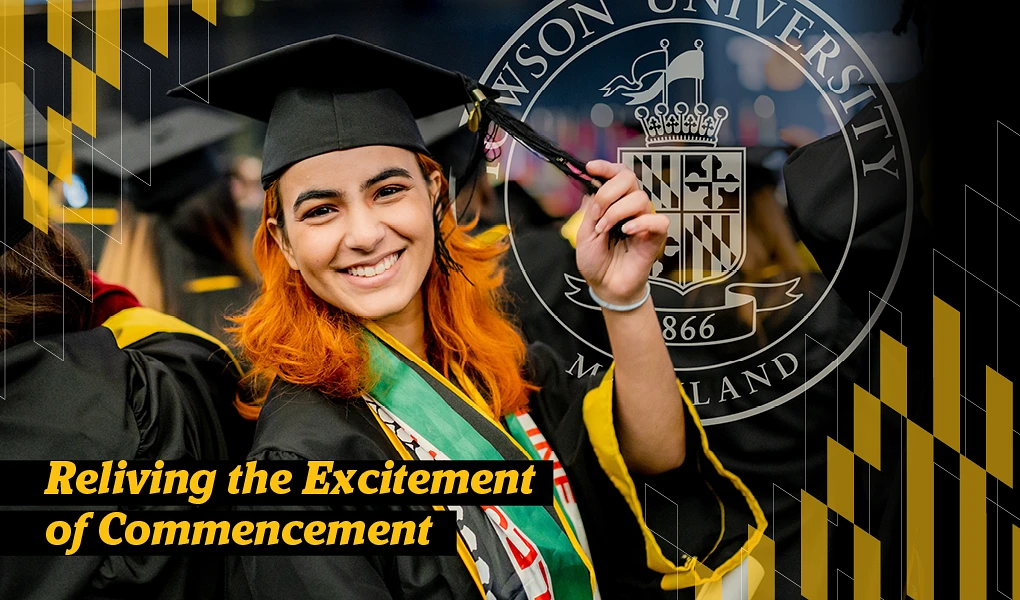 Graduate in regalia smiling at camera